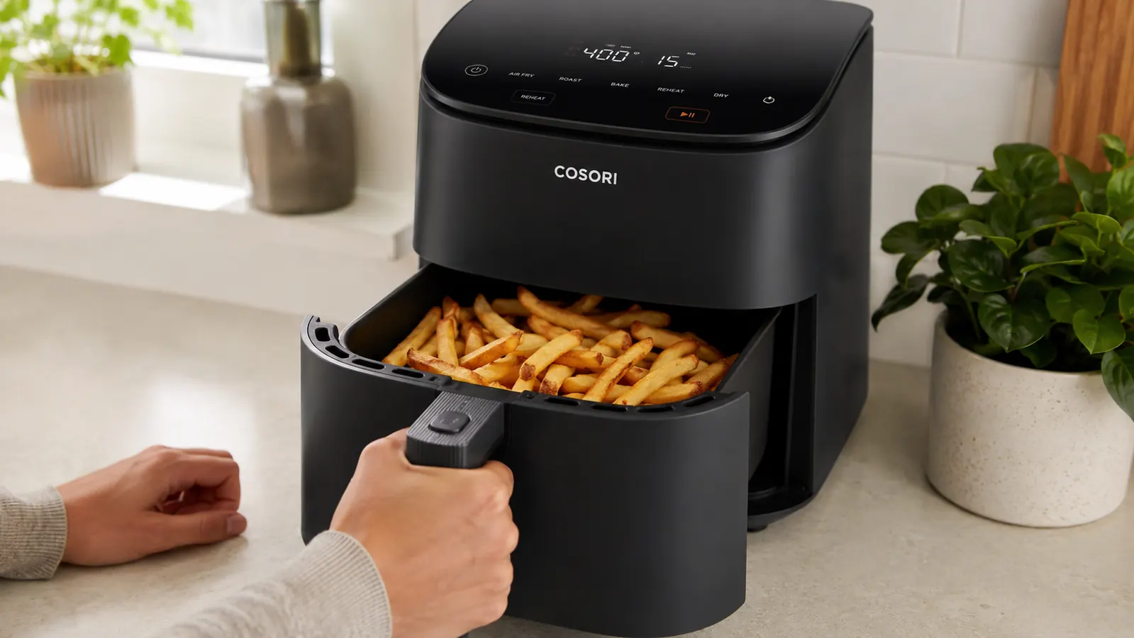 Cosori TurboBlaze air fryer basket open showing ceramic interior with food inside
